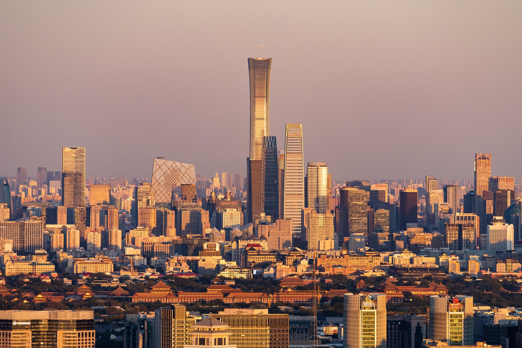 Beijing CBD skyline with China Zun rising above the surrounding towers in clear weather.
