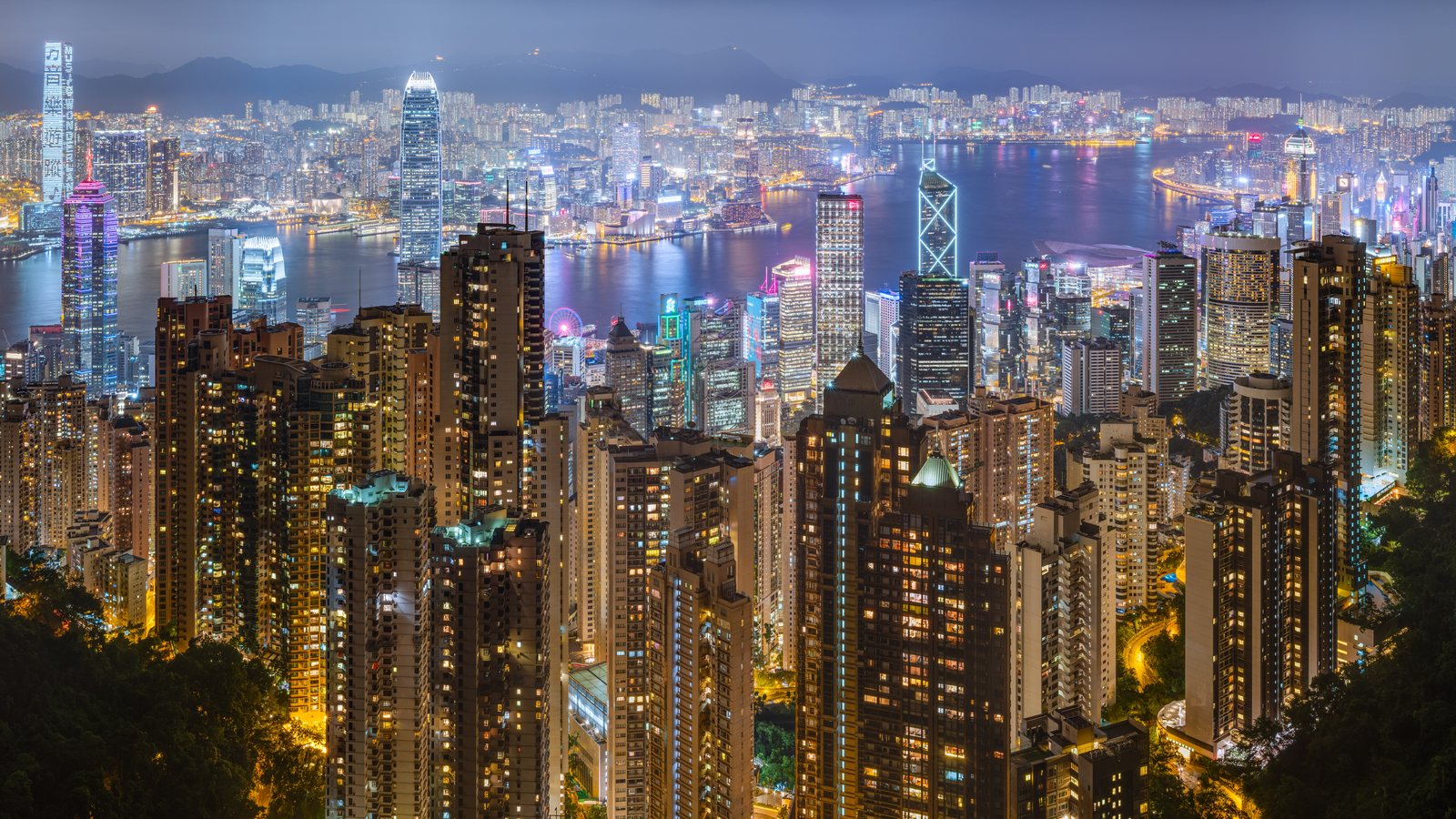 Night skyline of Hong Kong around Victoria Harbour.
