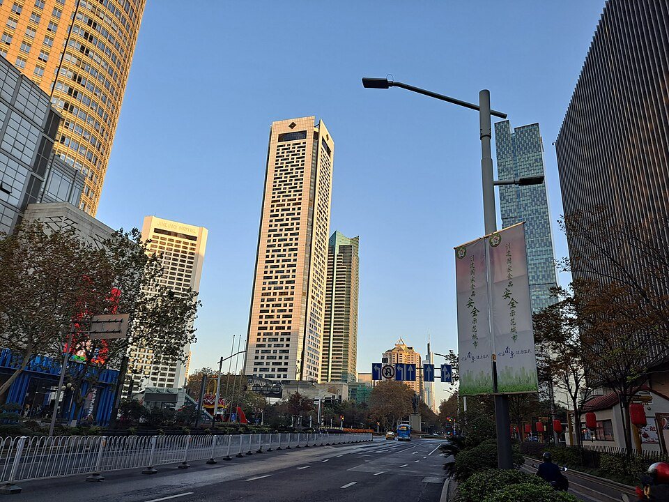 Modern towers and busy commercial streets in Nanjing's Xinjiekou district.