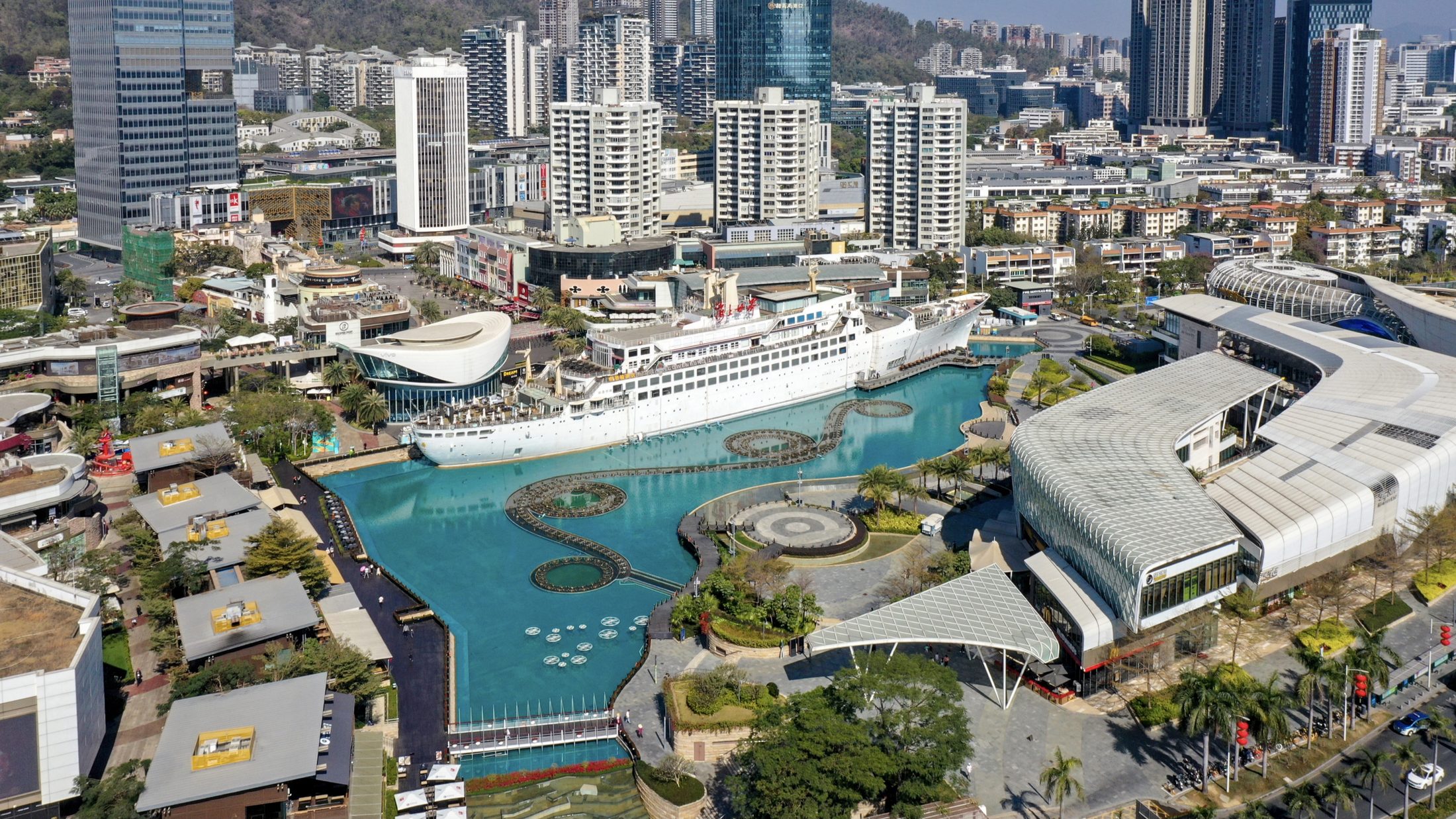 The Minghua ship and surrounding Sea World plaza in Shekou, Shenzhen, seen from above on a clear day.