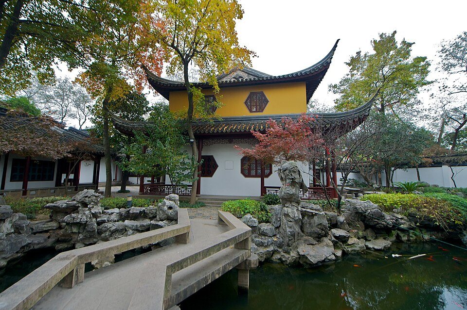 Pagoda and temple architecture at Hanshan Temple in Suzhou lit by clear daylight.