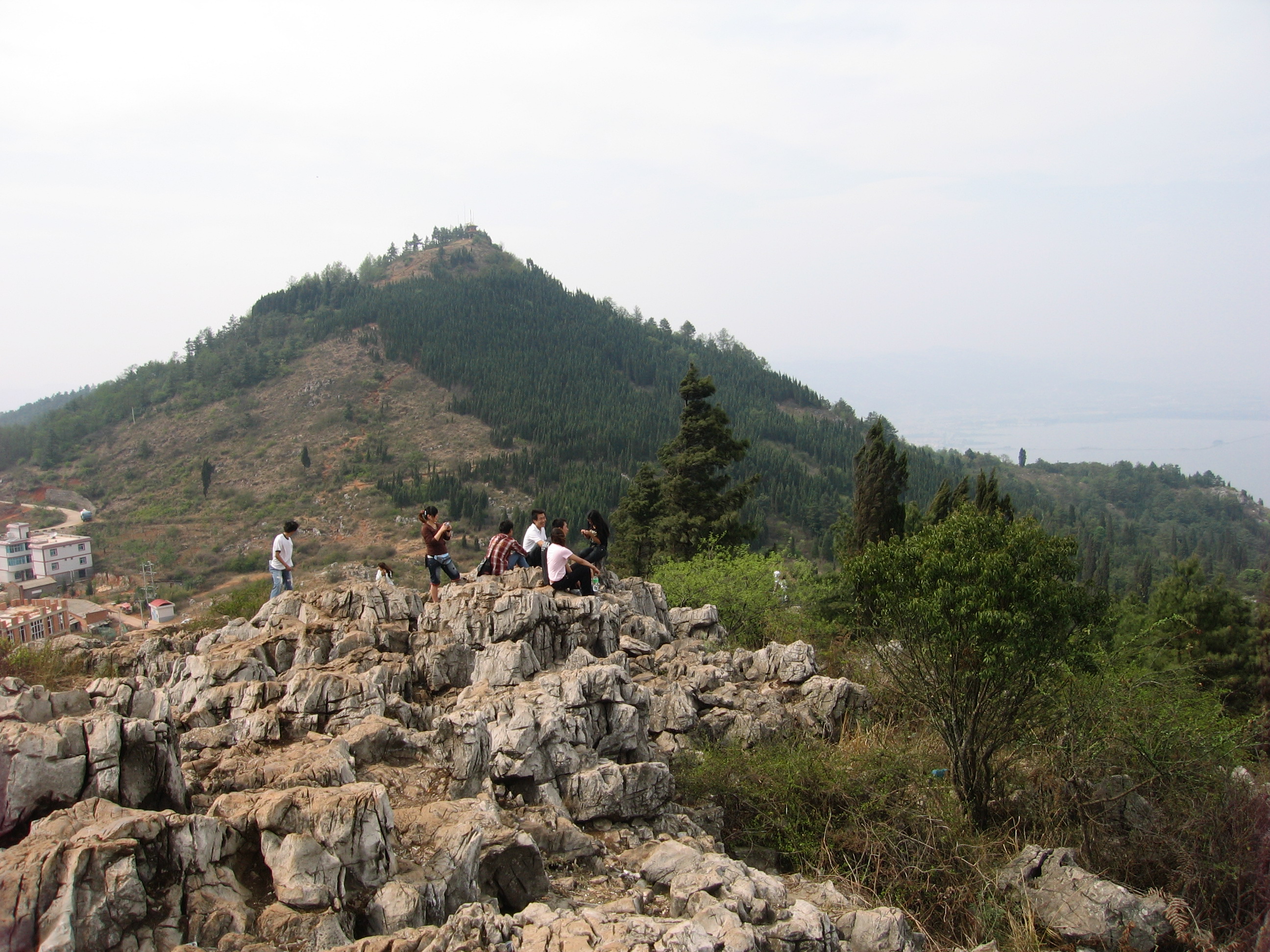 The western hills above Kunming, where the city gives way to a broader Yunnan horizon and the capital begins to feel less administrative and more geographic.