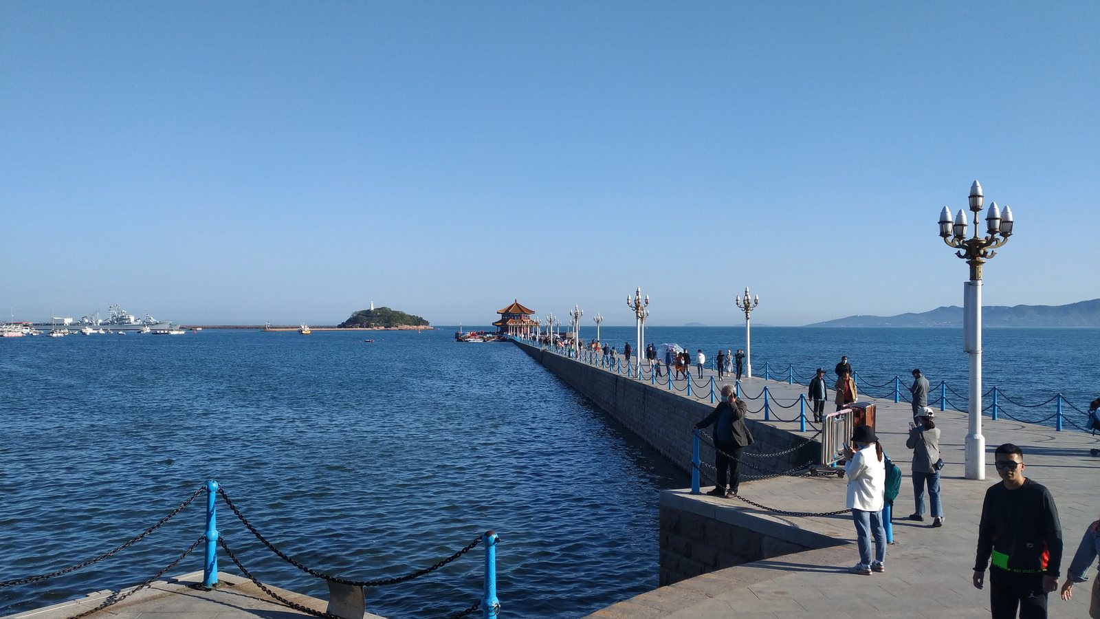 Zhanqiao Pier stretching into the sea in Qingdao with Little Qingdao beyond.