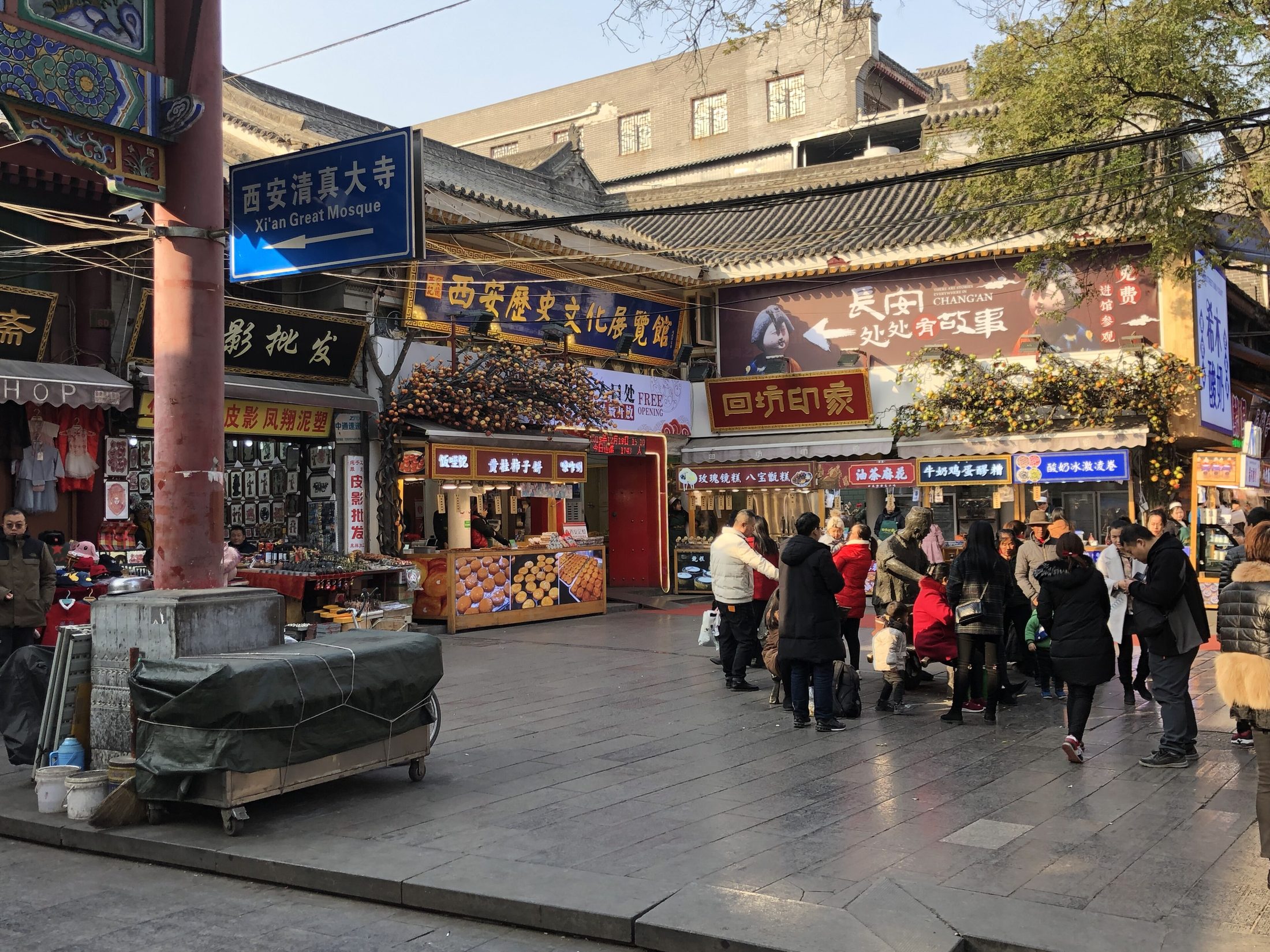 Evening crowd and snack stalls in Xi'an's Muslim Quarter