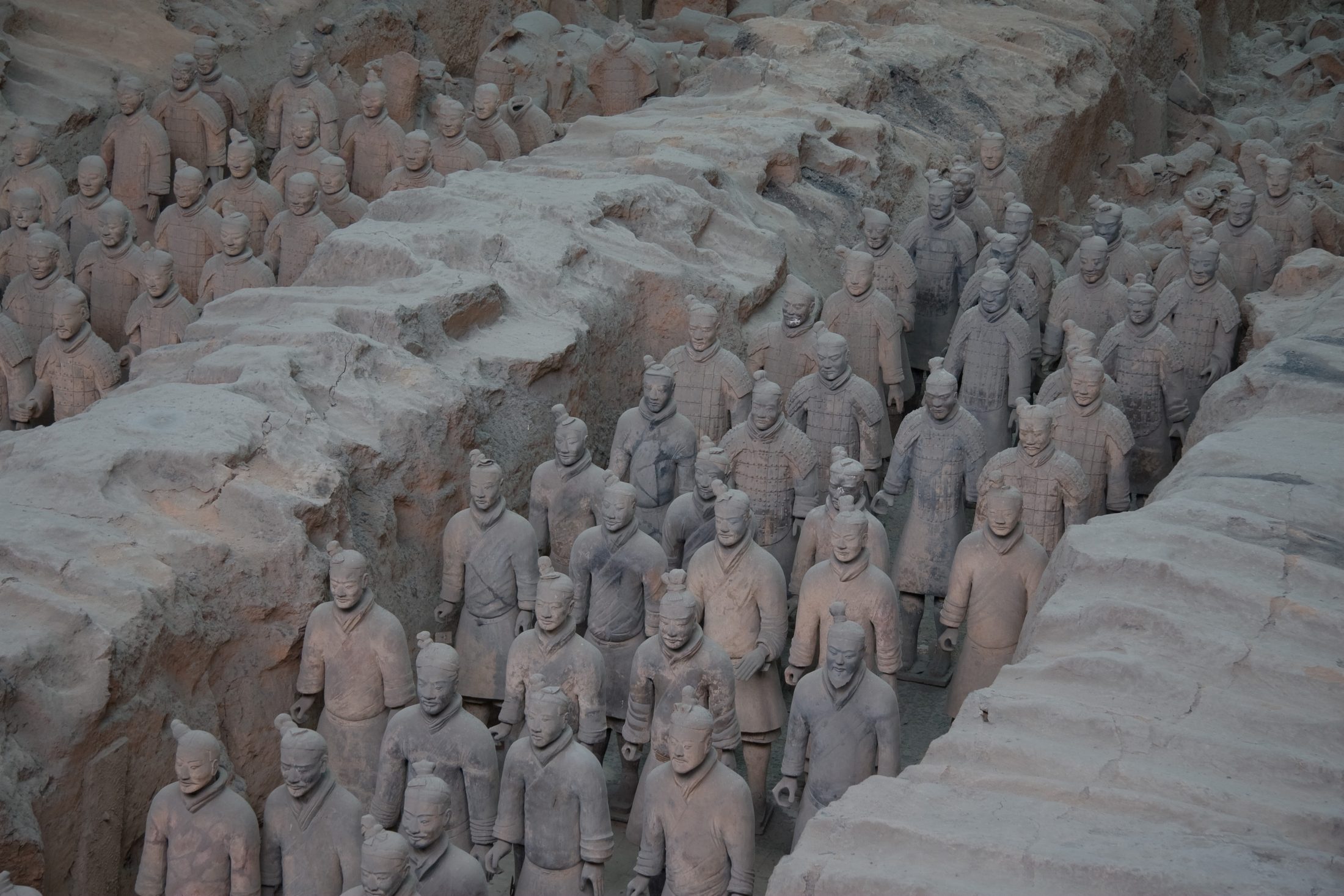 Rows of Terracotta Warriors inside the excavation hall near Xi'an, where the city's underground history turns materially visible.