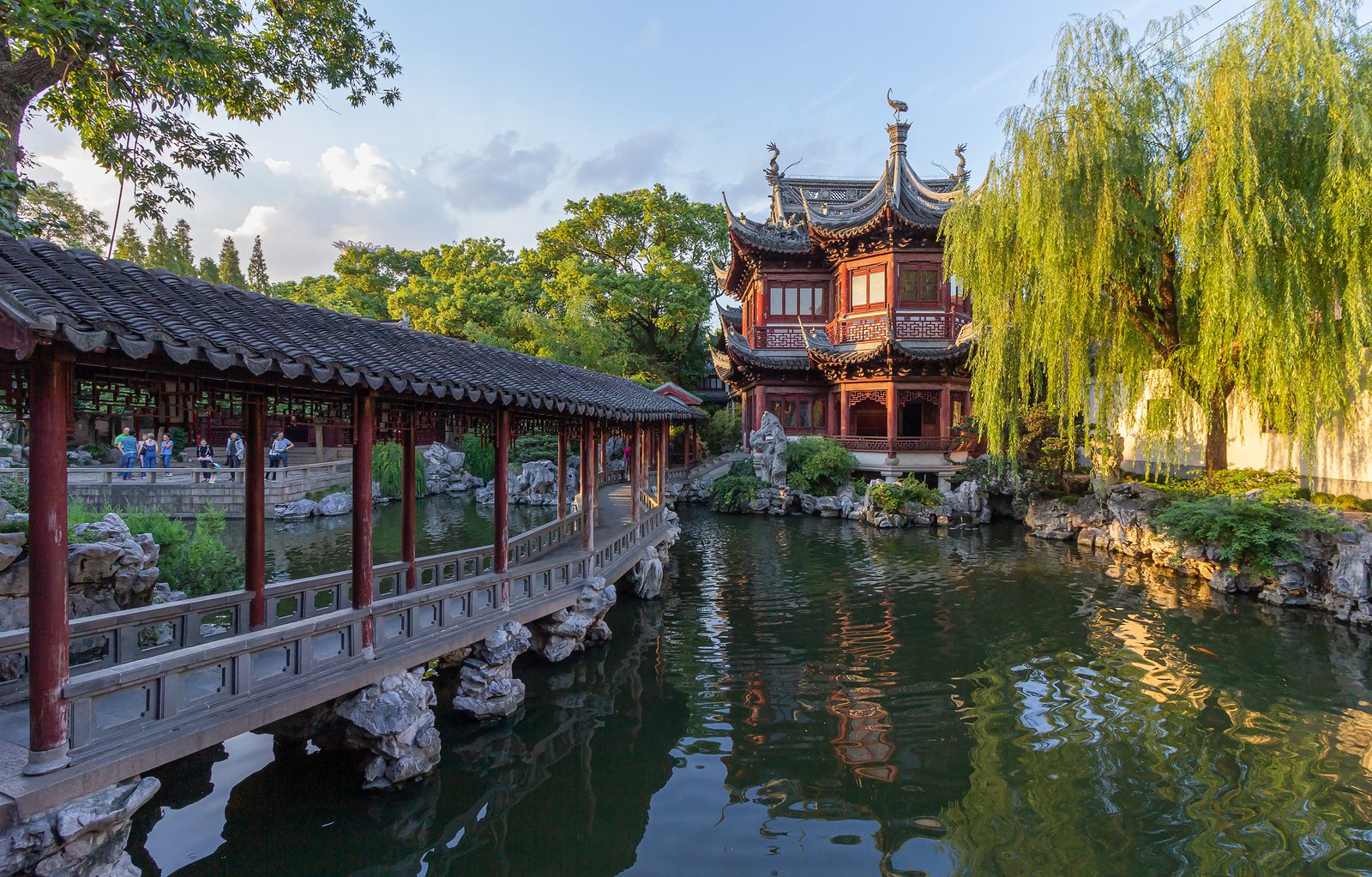 Illuminated pavilions and water reflections at Yu Garden in Shanghai.